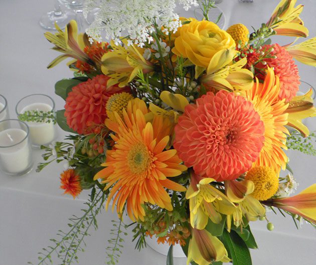 Vibrant orange and yellow bouquet centerpiece