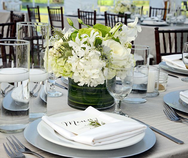 Elegant wedding table setting with white centerpiece
