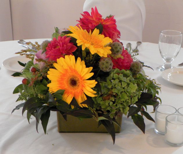 Yellow gerbera centerpiece with pink flowers