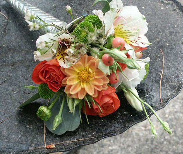 Bridal bouquet with peach dahlia and orange roses