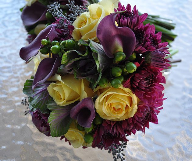 Yellow roses and purple calla lily bouquet