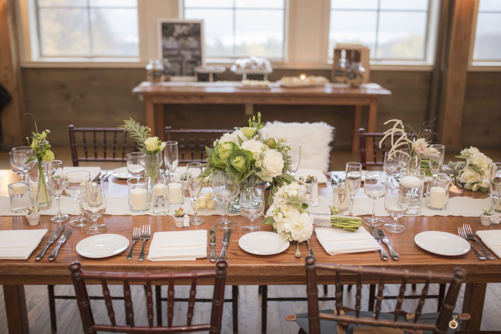 Rustic wedding table with white floral centerpiece