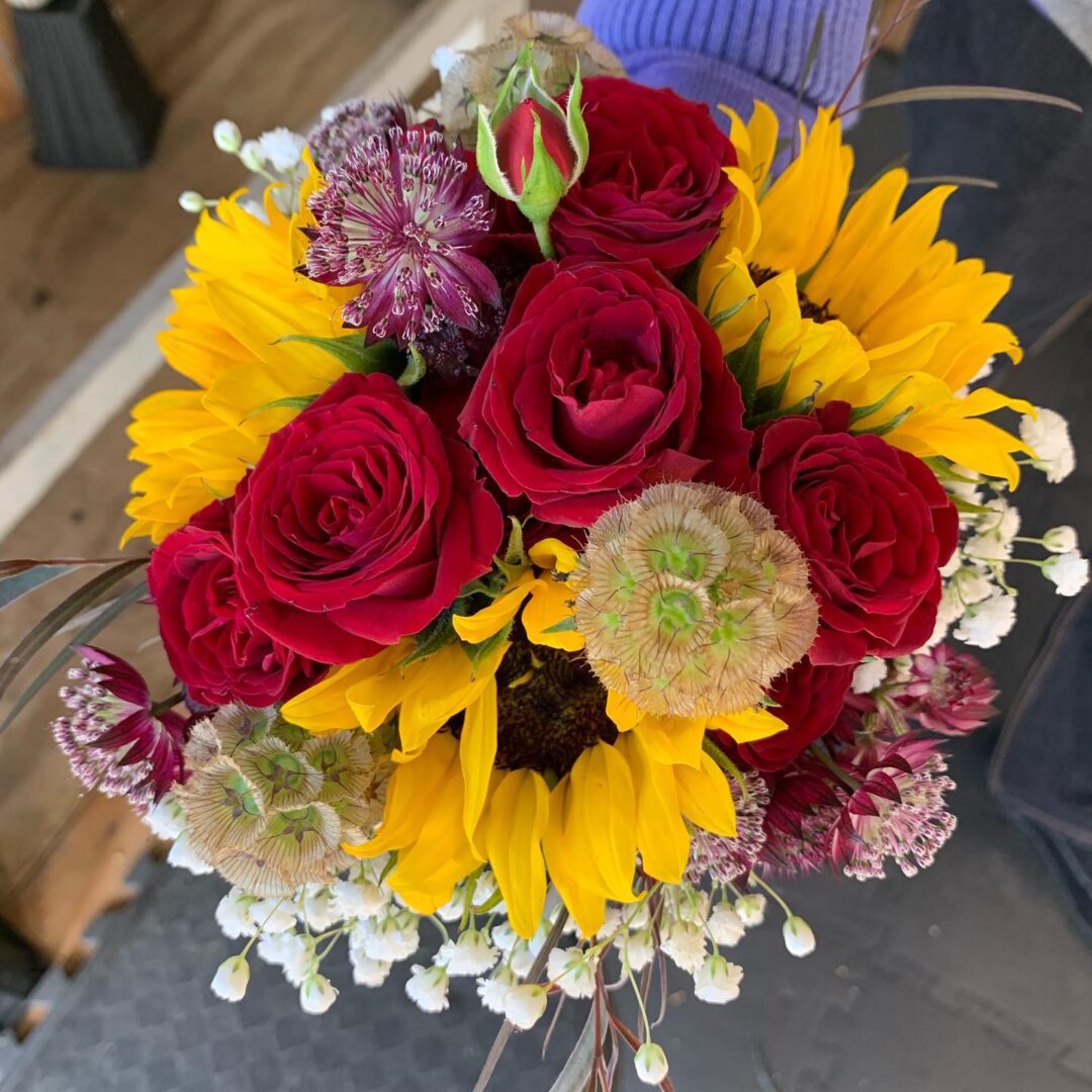 Bouquet of sunflowers and red roses