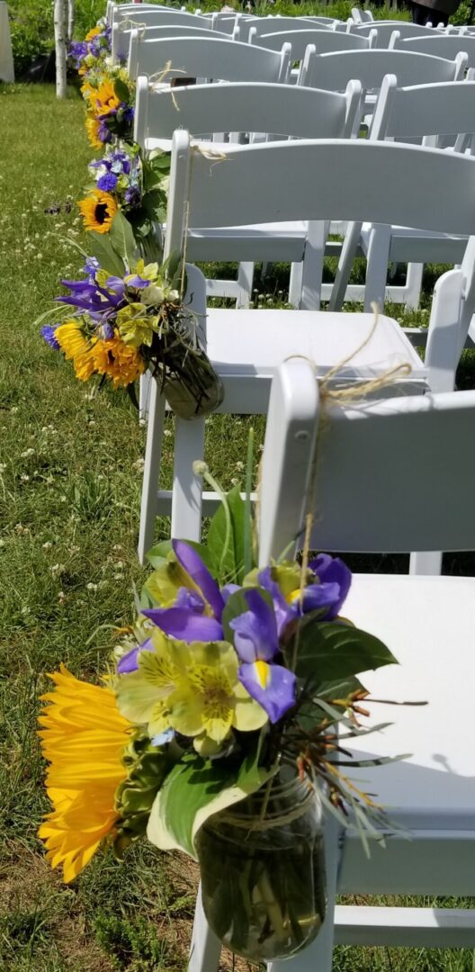 Mason jar sunflower and purple aisle decorations