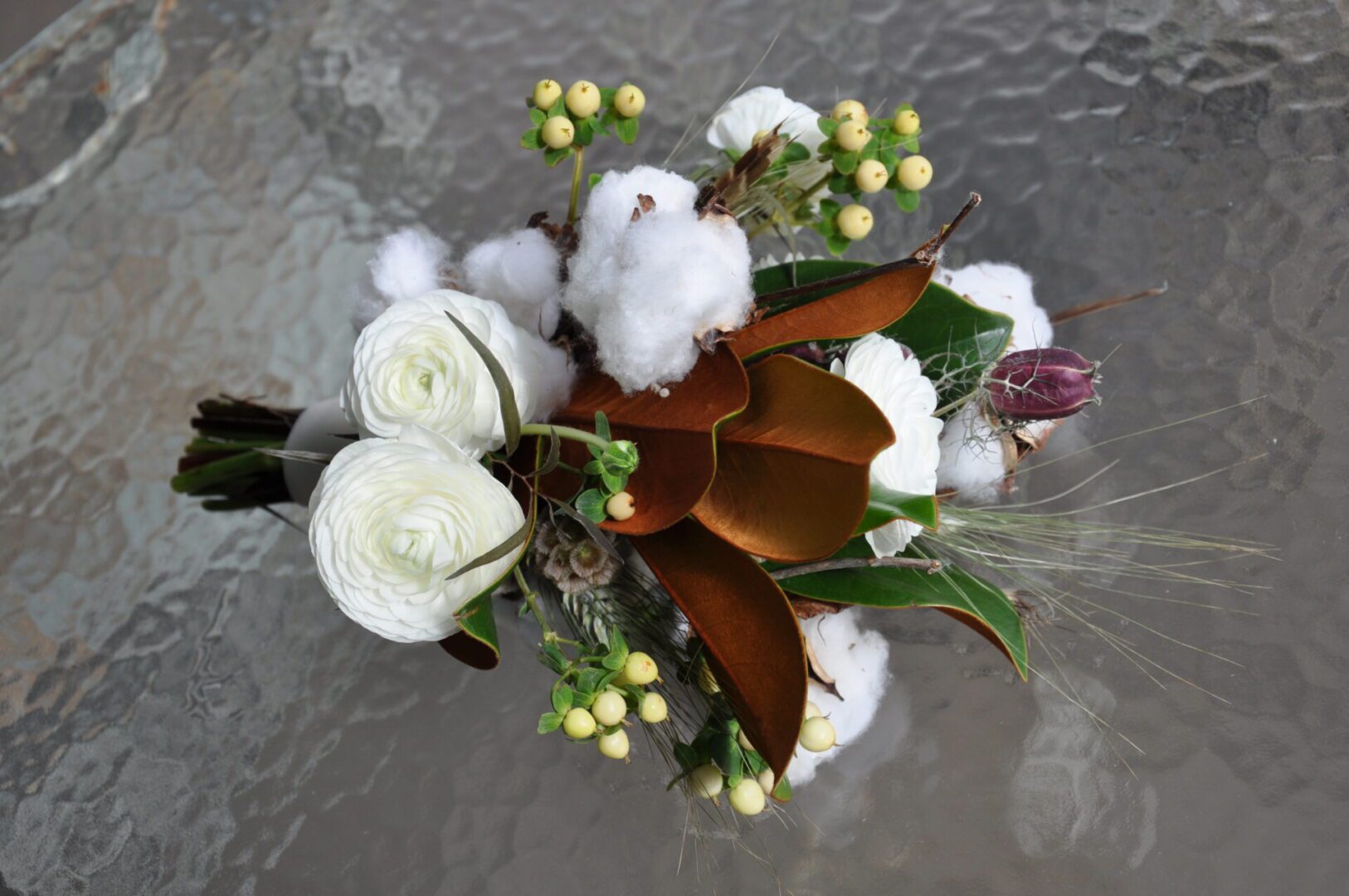 White floral bouquet with cotton bolls and leaves