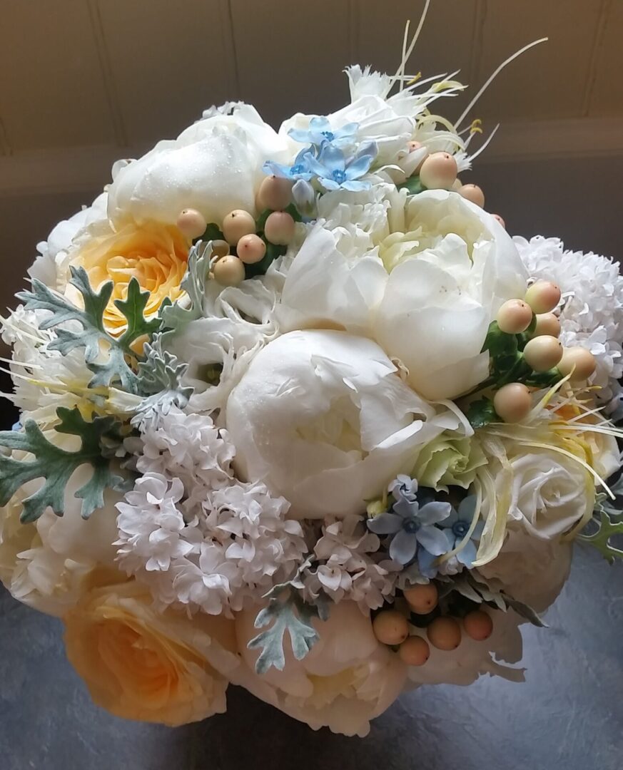 White peony and yellow rose bridal bouquet